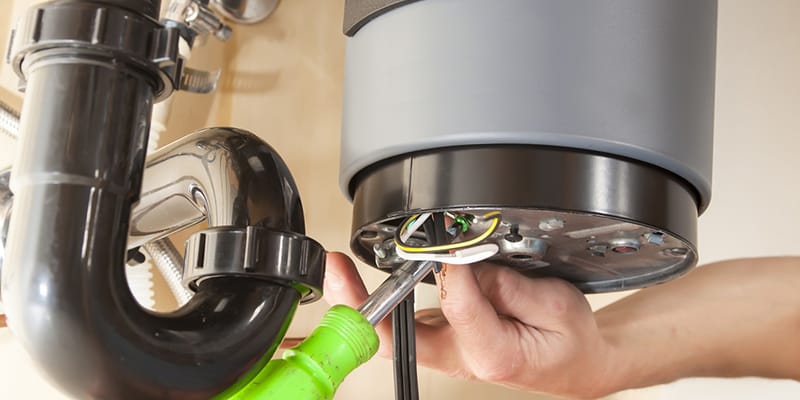 Technician repairing the heating element of a water heater in Coachella